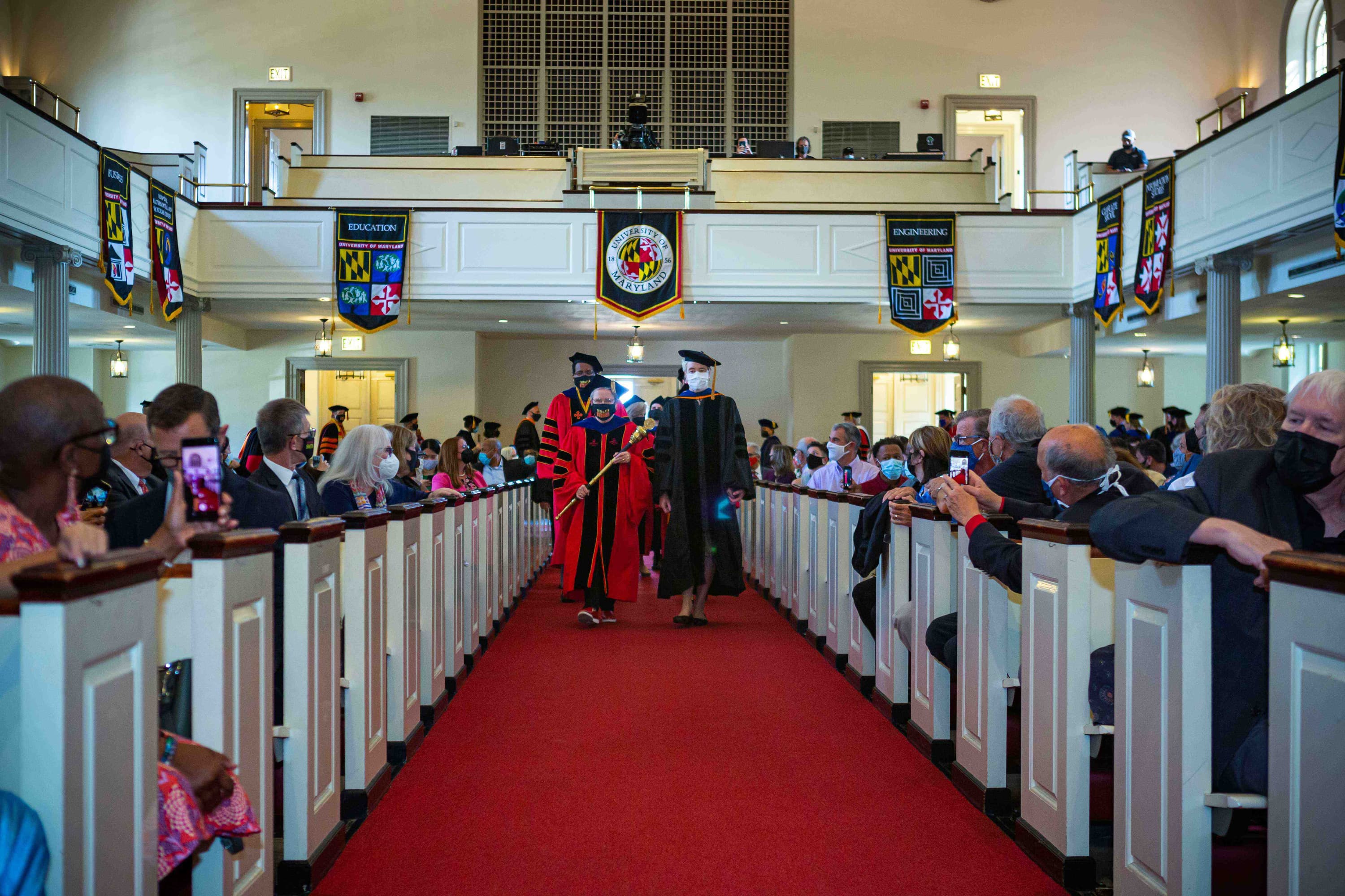 Faculty & Staff walking down the chapel aisle during Convocation