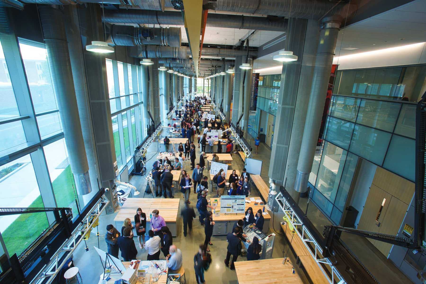 Overhead picture of people talking in Innovation Lab