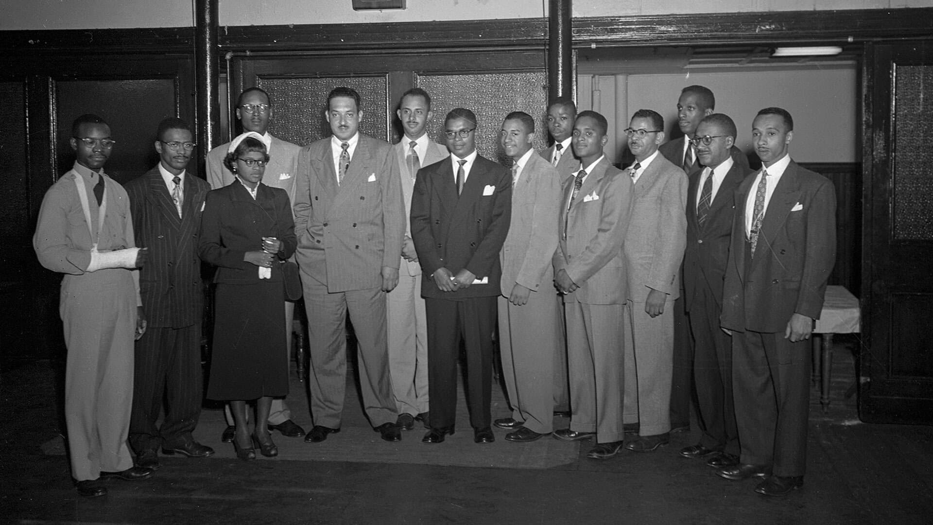 image ofIn this 1950 photo by Paul Henderson, then-NAACP lawyer Thurgood Marshall (fifth from right) is shown with other civil rights activists, including future UMD students Hiram Whittle (sixth from right) and Parren Mitchell (far right). Courtesy of the Maryla