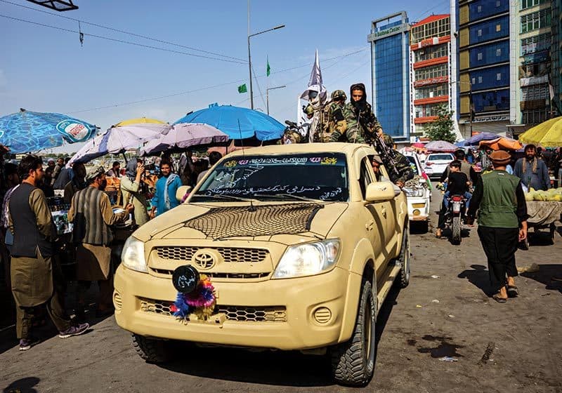 Taliban patrol rolls through Kabul in pickup