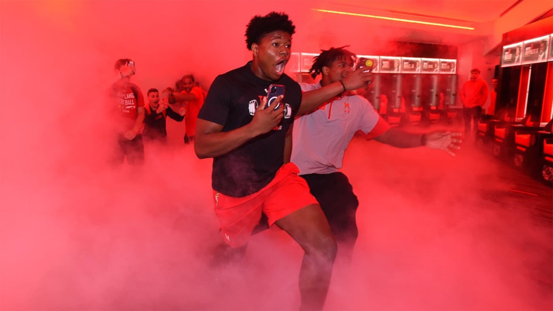 Football players run into new locker room