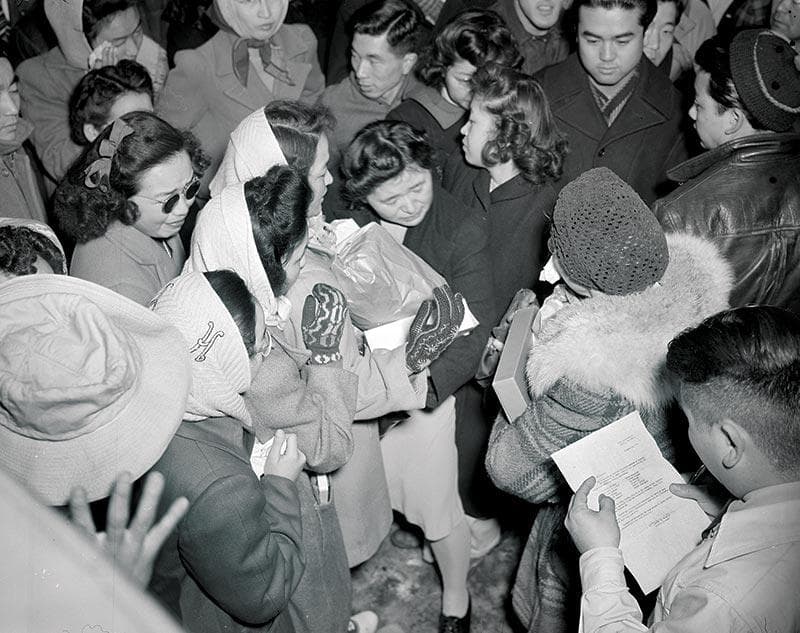 Prisoners in the Tule Lake Relocation Center in California say goodbye to people being transferred and granted leave.