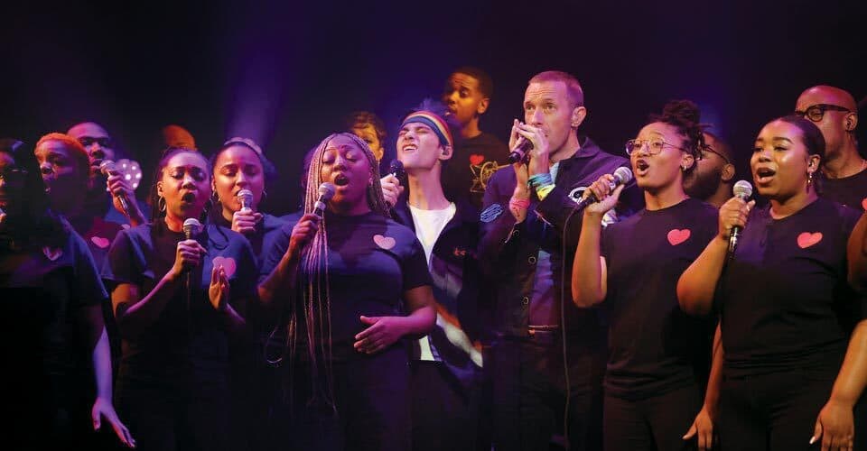 singers perform on stage at SNL