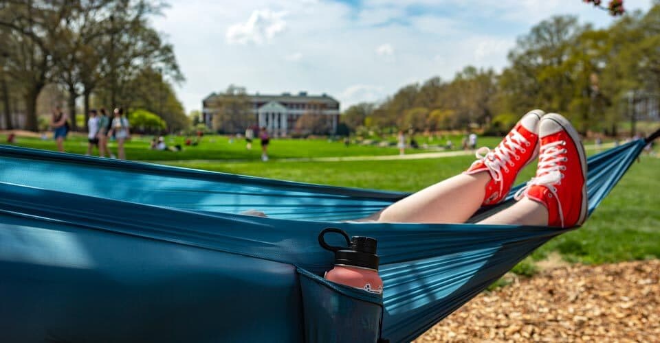 red shoes peek out of a teal hammock on McKeldin Mall