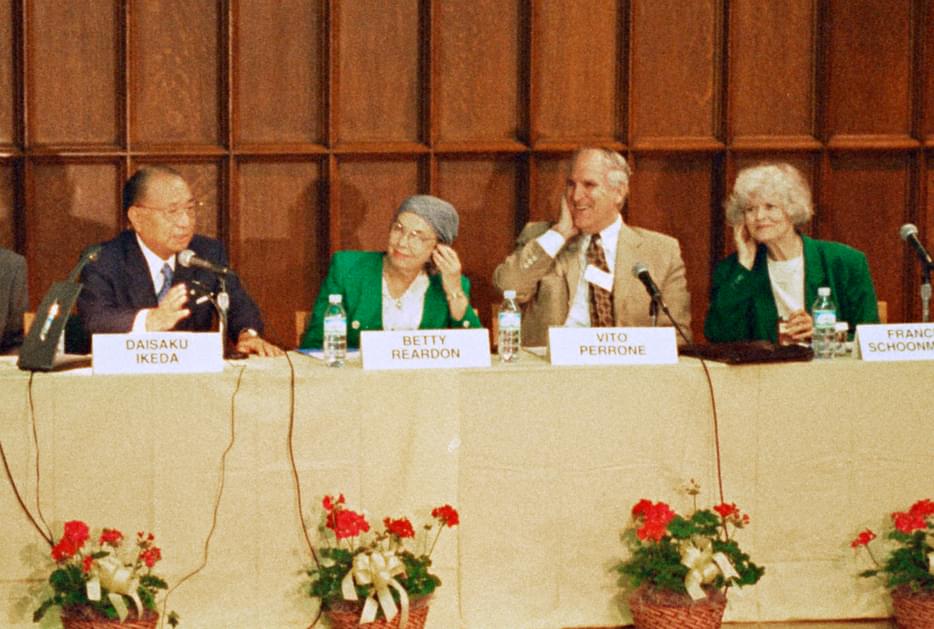 Four speaker sitting at panel (Daisaku Ikeda far left).