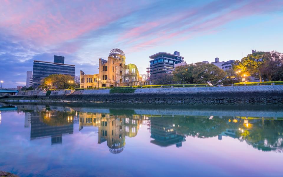 Hiroshima peace memorial at sunset with the river in the foreground