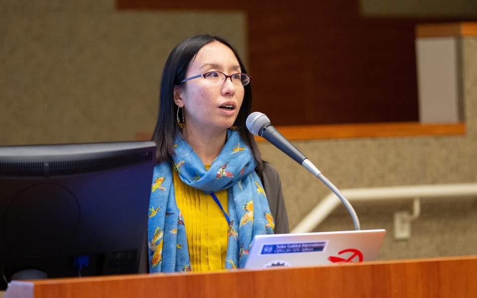 woman speaking at a podium