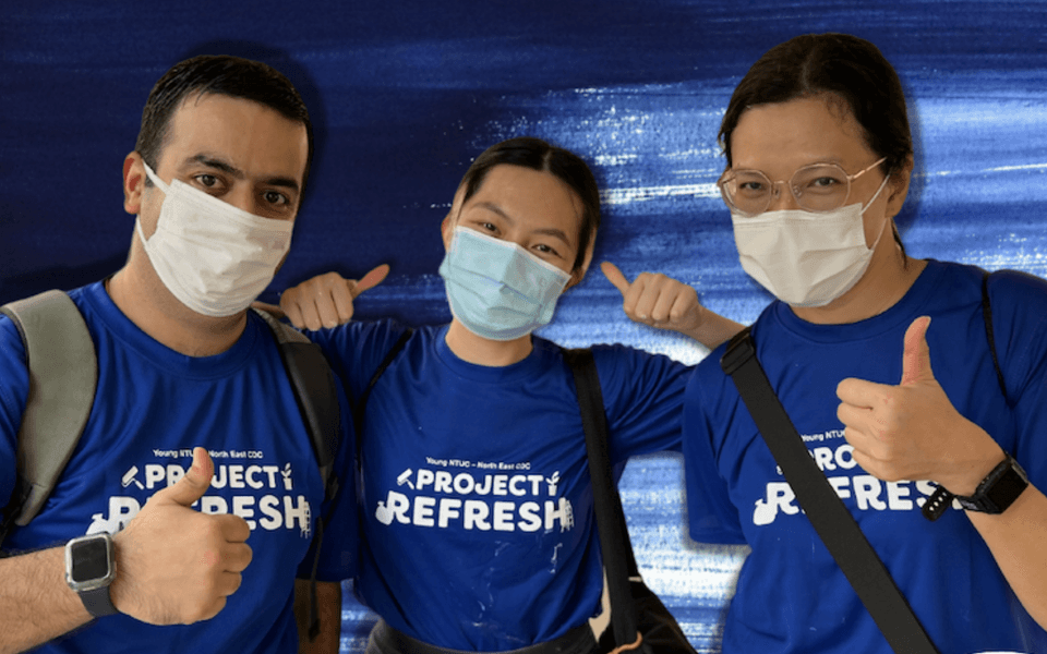 Three youth wearing matching project t-shirt giving the thumbs up
