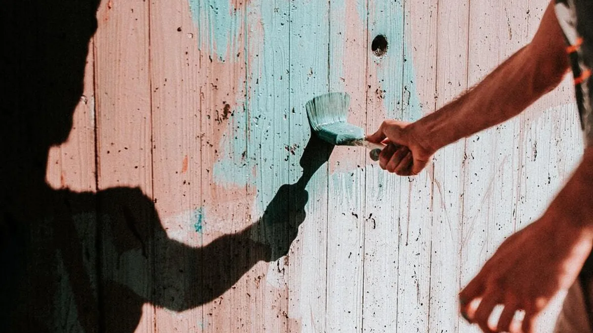 Painting a garden fence