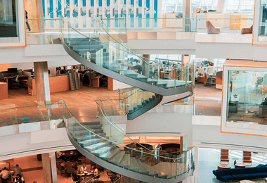 a spiral glass railing design for commercial buildings