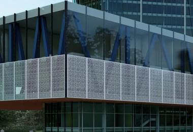 a parking garage facade enhancing design of a parking lot