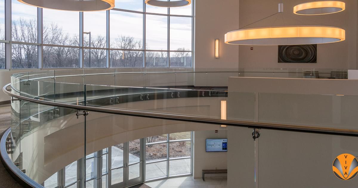 Curved Glass Button Railing - VIEW | Kemin Research… | VIVA Railings