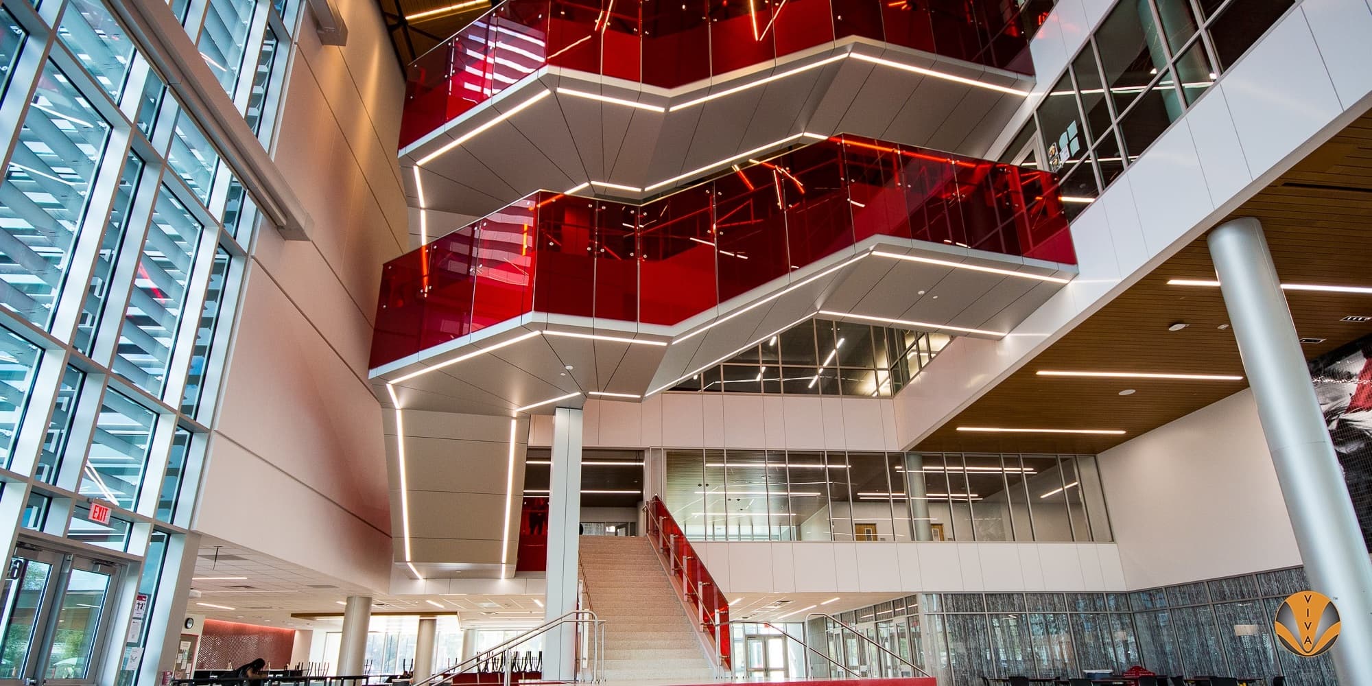 Monumental stair with custom designed and engineered stainless steel post railing system at SB-ISD near Houston, TX