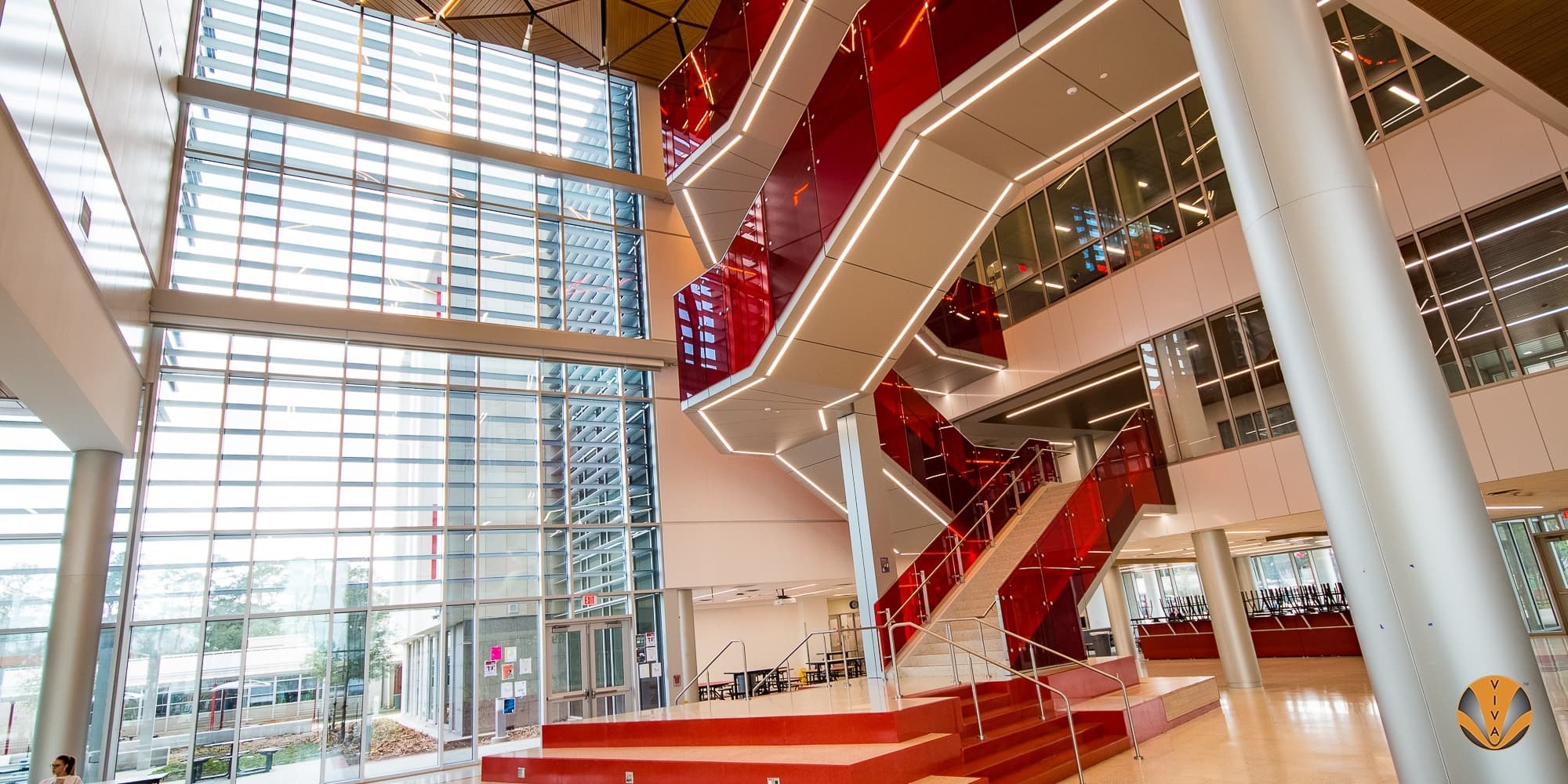 Monumental stair with custom designed and engineered stainless steel post railing system at SB-ISD near Houston, TX