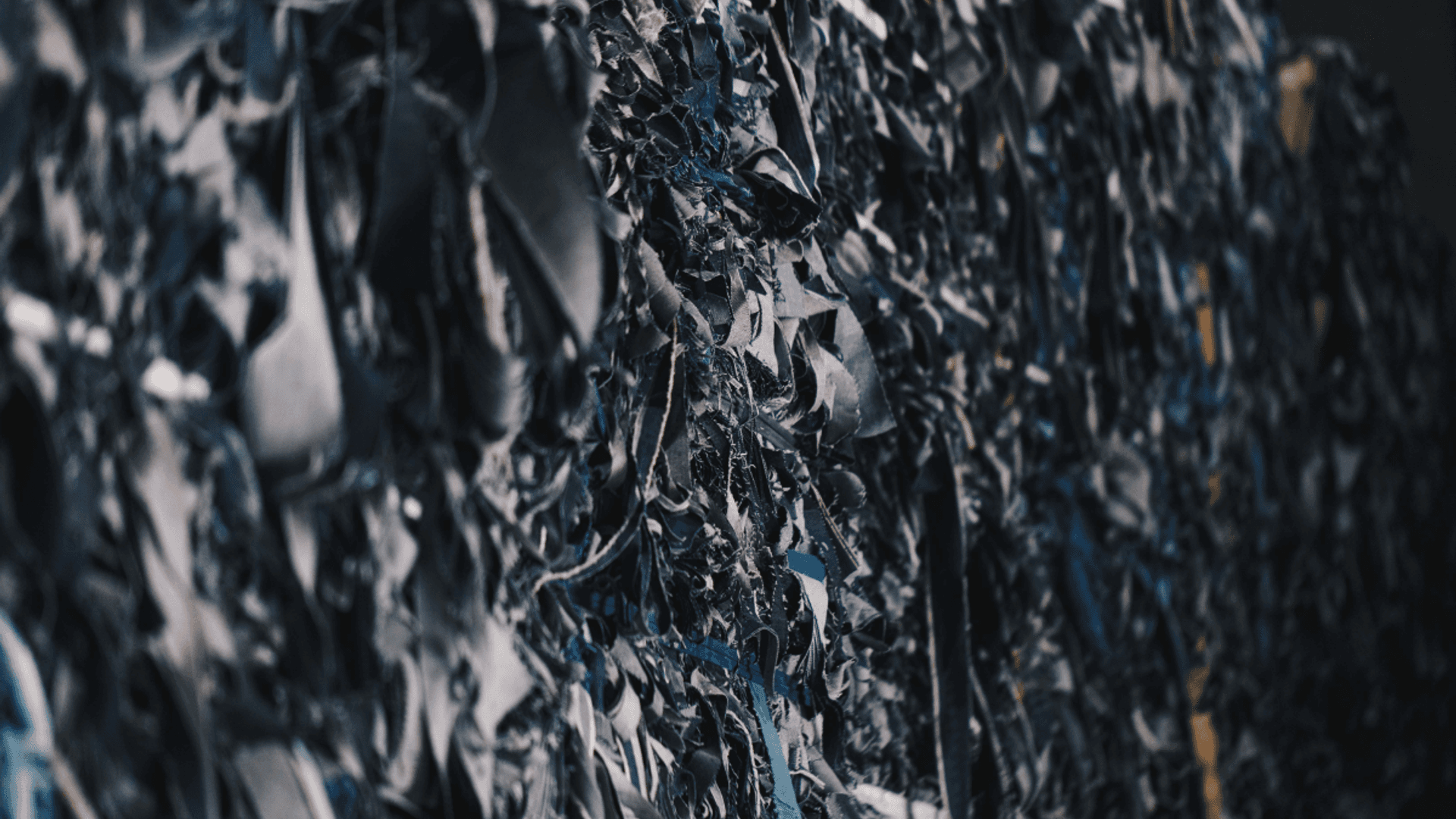 A close-up picture of denim textile waste (clips)