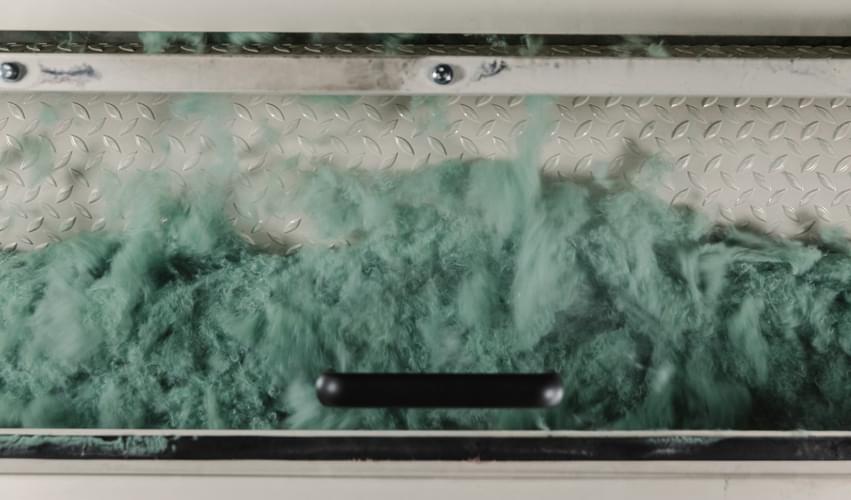 Recover™ cotton fibers being shredded into our mechanical recycling process, proprietary to Recover and able to achieve the maximum fiber length.
