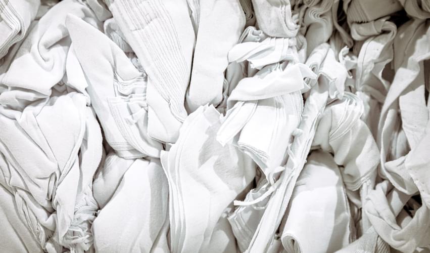 Textile Waste from post-industrial or post-consumer origin, ready to be recycled through the Recover™ mechanical process to create high-quality recycled cotton fibers