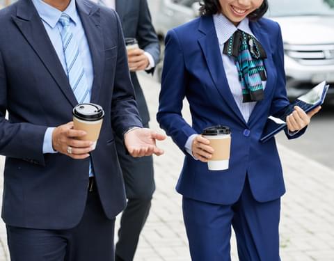 Crop businesspeople with coffee strolling on stree 2023 11 27 05 36 02 ut 2c