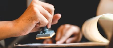 Hand stamping with approved stamp on certificate d 2022 09 28 22 45 02 utc