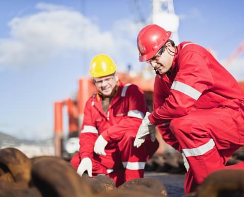 Workers on oil rig examining chains 2021 11 16 20 31 33 utc cropped
