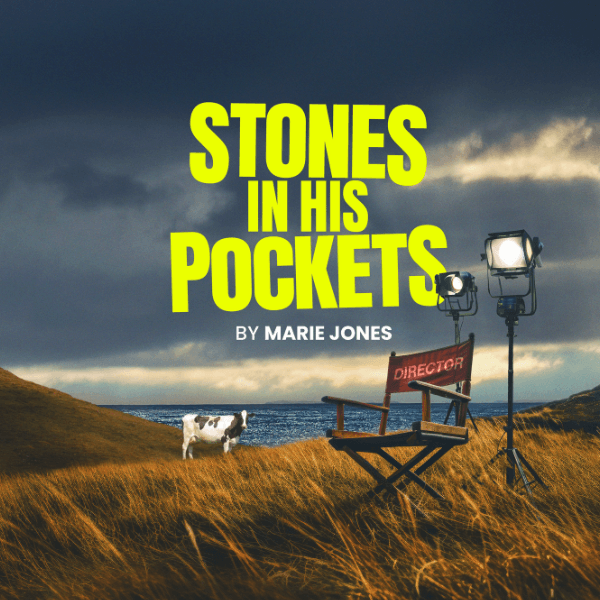 A dark, cloudy sky with the sea in the background and grass fields in the foreground. a cow, director's chair and two stage lights are in the field. The title reads "Stones in his Pockets by Marie Jones"