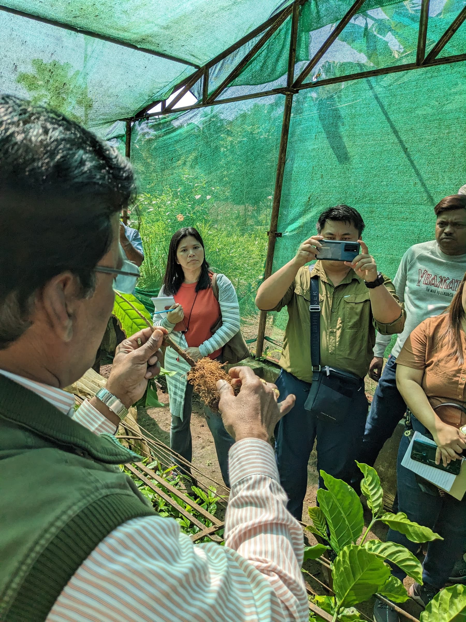 Dr. Surya Prakash explains the process of root development during vegetative propagation to Dr. Miriam Balthazar (Cavite State College) and Dr. Apolinario Gonzaga Jr. (University of Science and Technology of Southern Philippines).